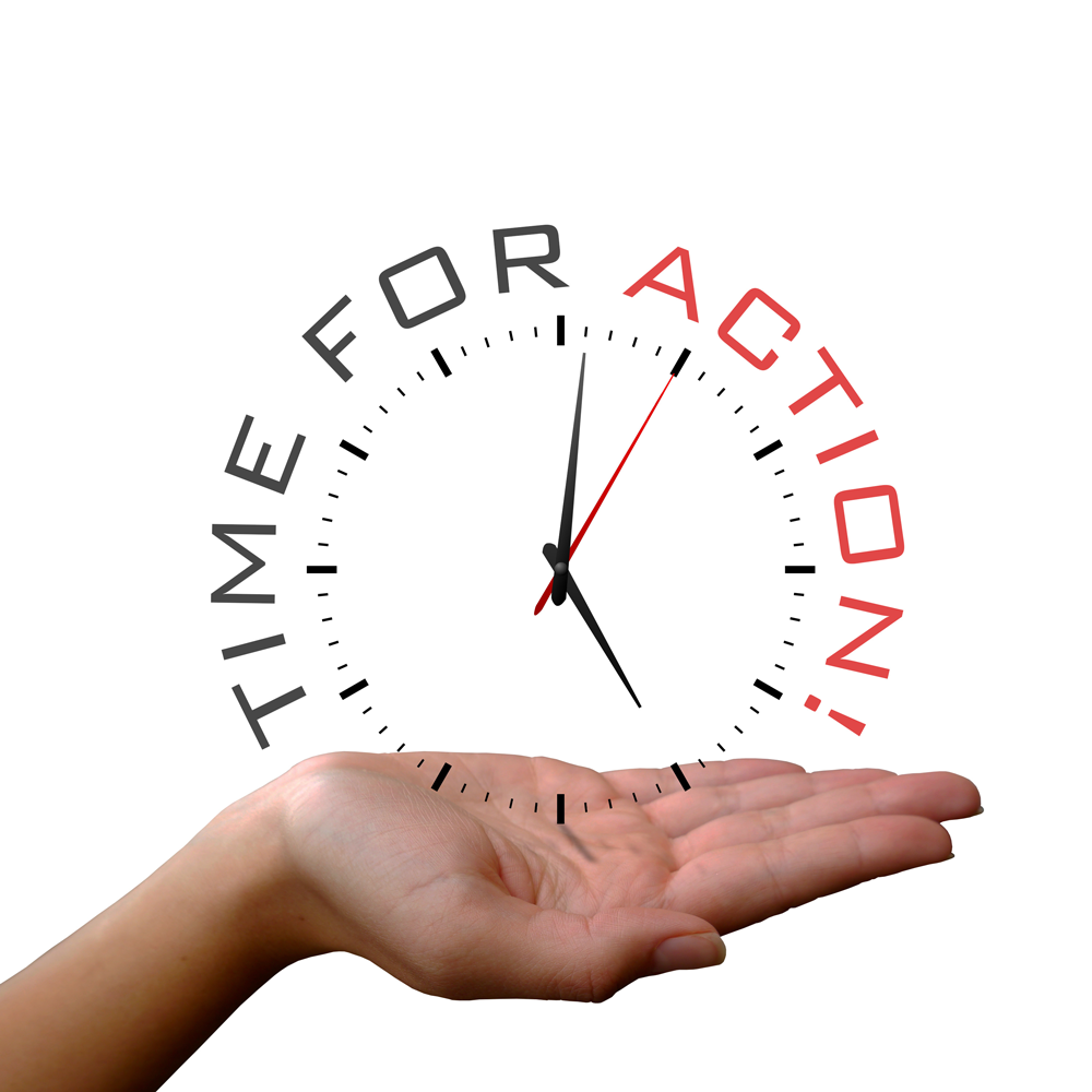 A right hand who's palm is face up, holding just the face of a clock with the seconds hand indicating motion. The tick marks of the clock are circumscribed by the words "TIME FOR ACTION!"